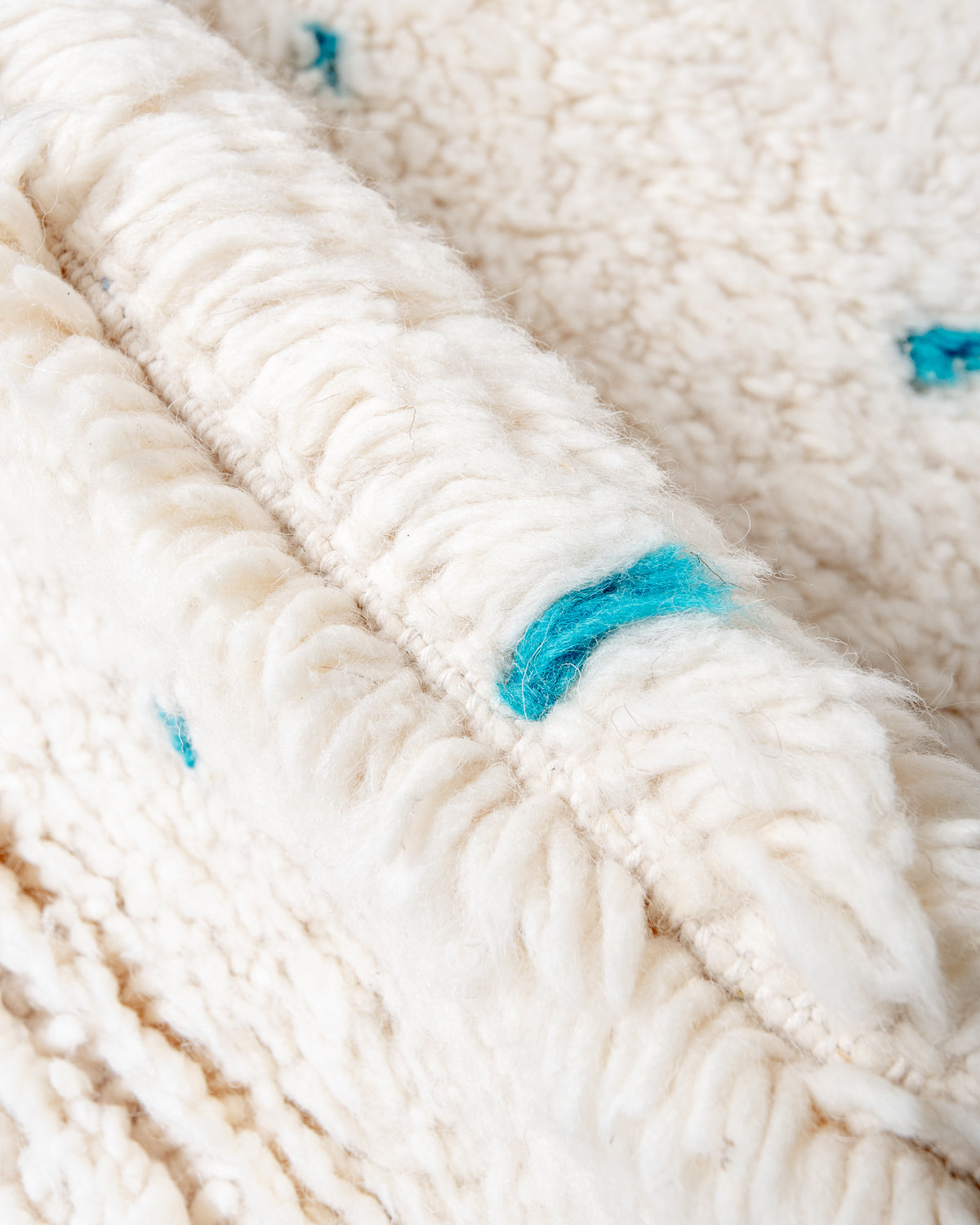 Modern, designer, handcrafted Berber rug from Morocco. Beniourain carpet with beautiful colours and patterns and fluffy wool texture.